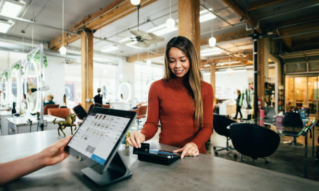 customer at the counter with a loyalty card