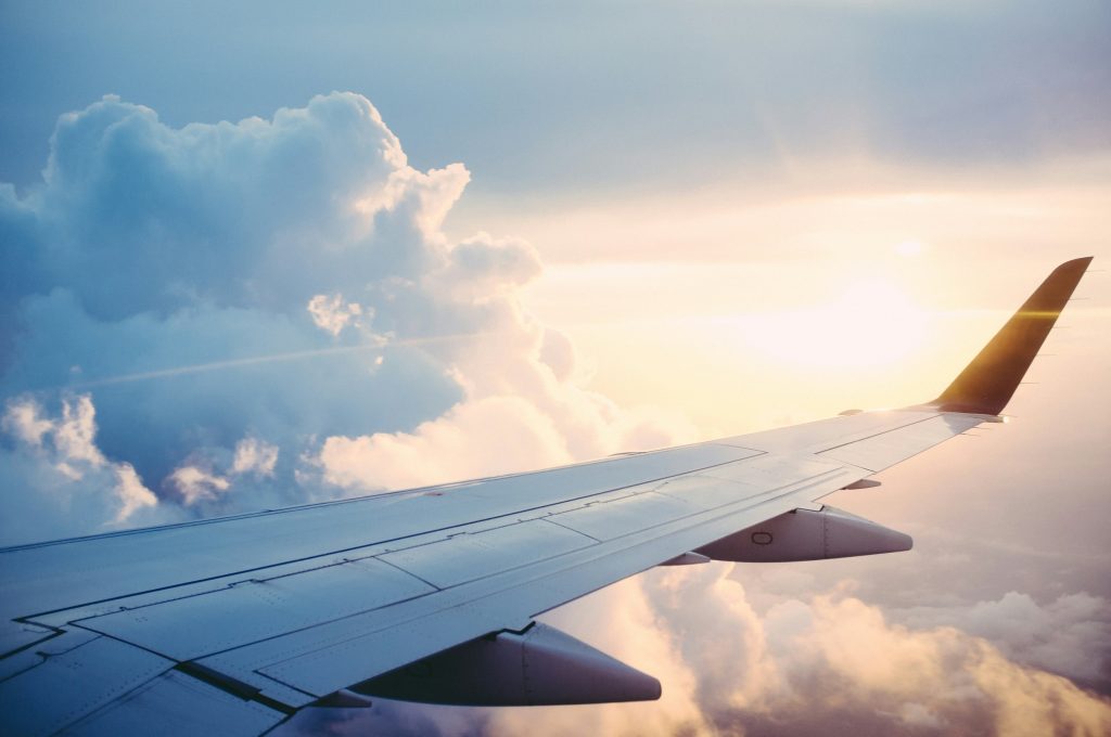 Image of sun and cloud from a plane seat's vantage point