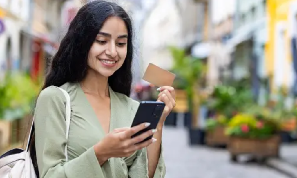 A girl and phone and card